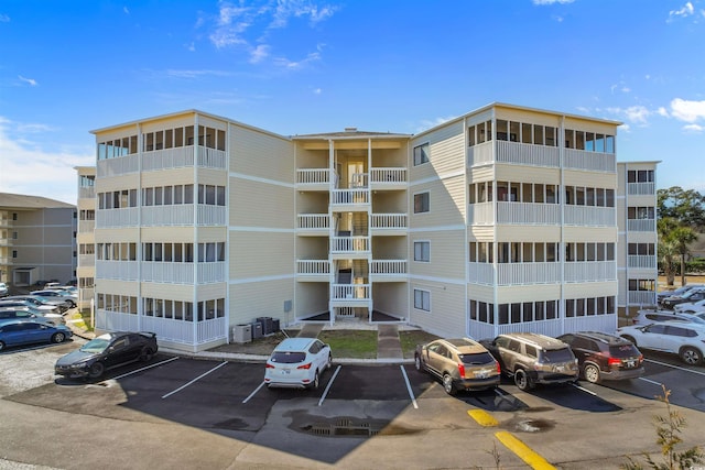 4350 Intercoastal Dr Unit 2408, Little River, SC 29566 - view of apartment building / complex with uncovered parking and cooling unit