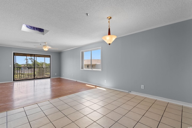 4350 Intercoastal Dr Unit 2408, Little River, SC 29566 - spare room with a ceiling fan, a textured ceiling, light tile patterned floors, a pendent fire sprinkler, and ornamental molding