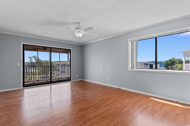 4350 Intercoastal Dr Unit 2408, Little River, SC 29566 - empty room with wood finished floors, ceiling fan, a textured ceiling, baseboards, and crown molding