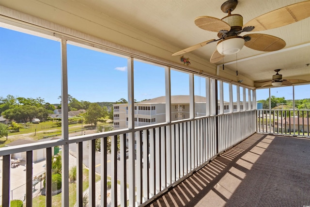 4350 Intercoastal Dr Unit 2408, Little River, SC 29566 - unfurnished sunroom featuring ceiling fan and a residential view