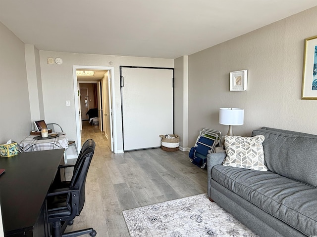 1501 S Ocean Blvd Unit 239, Myrtle Beach, SC 29577 - living area with a desk and wood finished floors