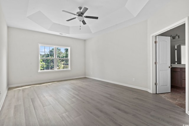 417 Grain Field Dr, Georgetown, SC 29440 - unfurnished room with a raised ceiling, a ceiling fan, baseboards, and wood finished floors