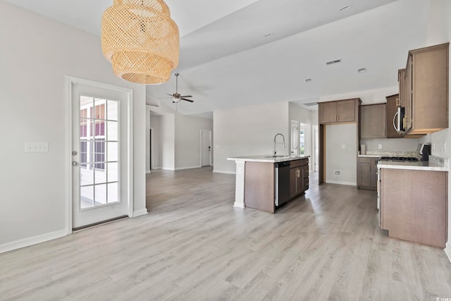 417 Grain Field Dr, Georgetown, SC 29440 - kitchen with open floor plan, stainless steel appliances, a sink, and light countertops