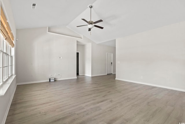 417 Grain Field Dr, Georgetown, SC 29440 - unfurnished room featuring a ceiling fan, wood finished floors, baseboards, and high vaulted ceiling