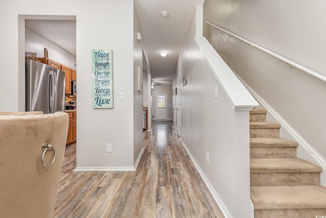 310 Kiskadee Loop Unit D, Conway, SC 29526 - hallway featuring light wood-style flooring and stairs