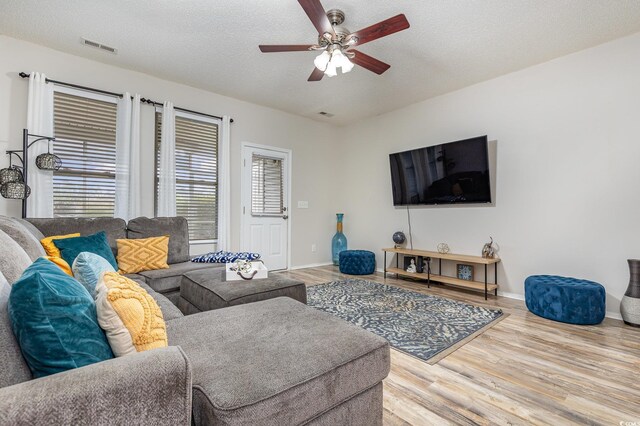 310 Kiskadee Loop Unit D, Conway, SC 29526 - living room with ceiling fan, wood finished floors, and a textured ceiling