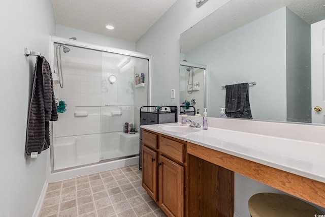 310 Kiskadee Loop Unit D, Conway, SC 29526 - full bath featuring a stall shower, vanity, and a textured ceiling