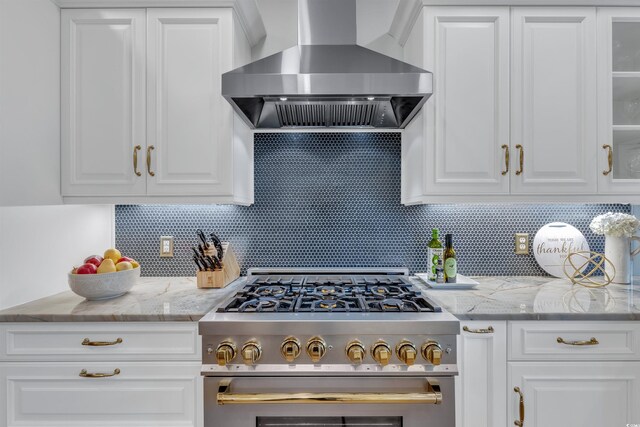 2150 N Berwick Dr, Myrtle Beach, SC 29575 - kitchen featuring wall chimney range hood, stainless steel stove, white cabinets, and backsplash