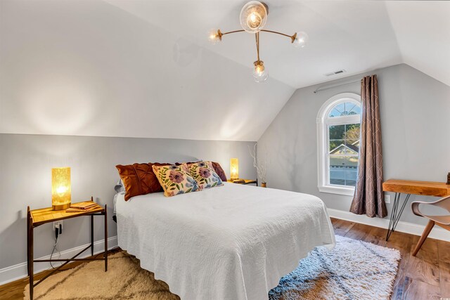 2150 N Berwick Dr, Myrtle Beach, SC 29575 - bedroom with vaulted ceiling, wood finished floors, and baseboards