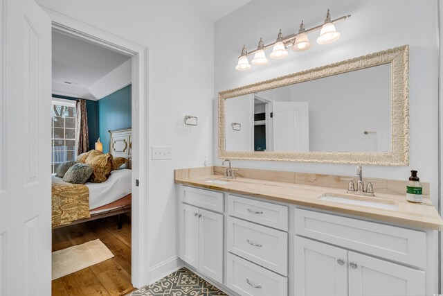 2150 N Berwick Dr, Myrtle Beach, SC 29575 - bathroom featuring double vanity, wood finished floors, and ensuite bathroom