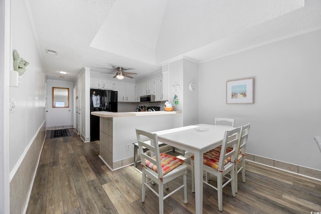 208 Ocean Blvd N Unit 324, North Myrtle Beach, SC 29582 - dining area featuring dark wood-style flooring, ceiling fan, lofted ceiling, and baseboards