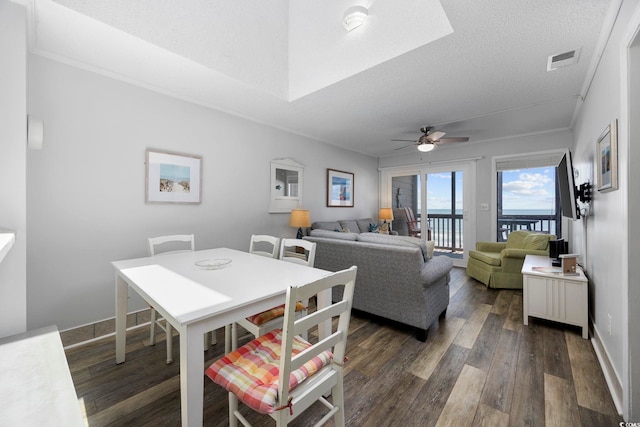 208 Ocean Blvd N Unit 324, North Myrtle Beach, SC 29582 - dining area featuring dark wood-style floors, crown molding, a ceiling fan, baseboards, and a textured ceiling