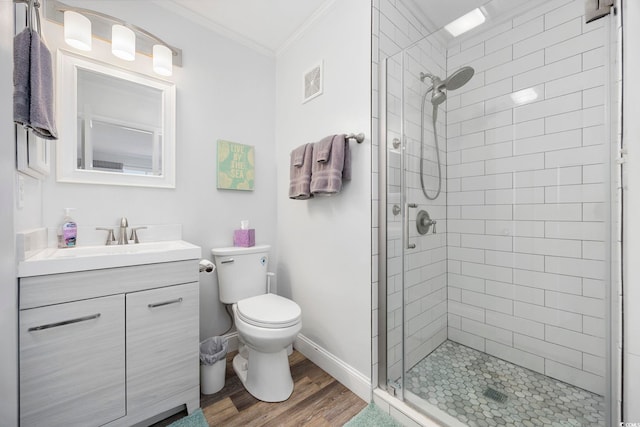 208 Ocean Blvd N Unit 324, North Myrtle Beach, SC 29582 - full bath featuring wood finished floors, a shower stall, vanity, crown molding, and toilet