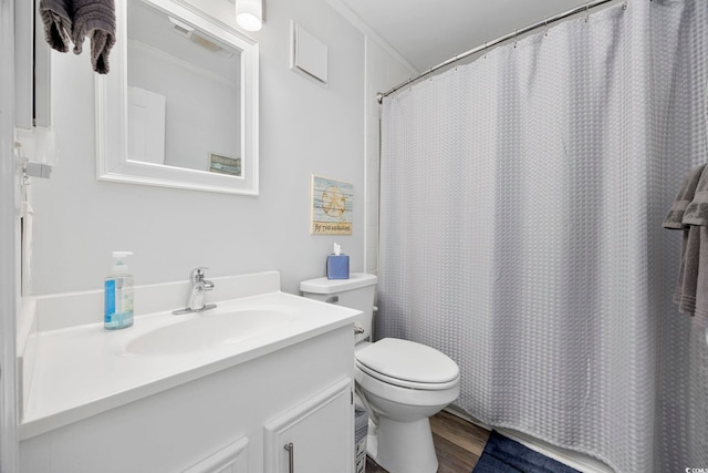 208 Ocean Blvd N Unit 324, North Myrtle Beach, SC 29582 - bathroom with toilet, vanity, wood finished floors, a shower with curtain, and ornamental molding
