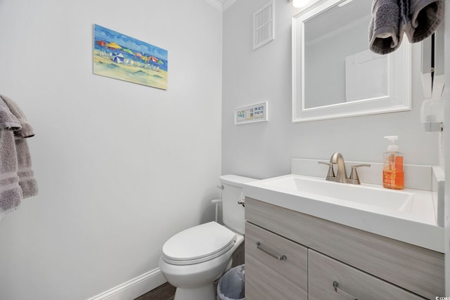 208 Ocean Blvd N Unit 324, North Myrtle Beach, SC 29582 - half bathroom featuring crown molding, vanity, toilet, and baseboards