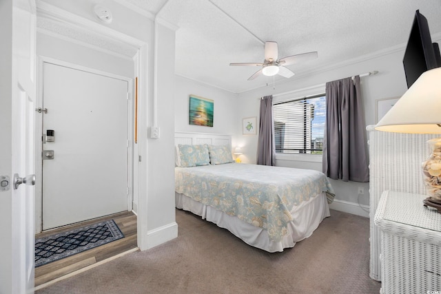 208 Ocean Blvd N Unit 324, North Myrtle Beach, SC 29582 - carpeted bedroom featuring ornamental molding, baseboards, a ceiling fan, and a textured ceiling