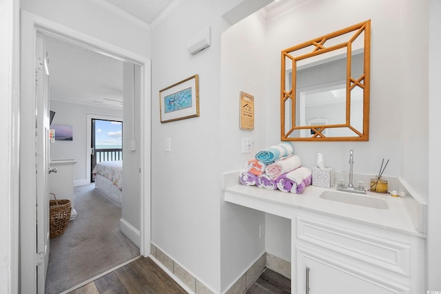 208 Ocean Blvd N Unit 324, North Myrtle Beach, SC 29582 - corridor with a sink, dark wood finished floors, crown molding, and baseboards