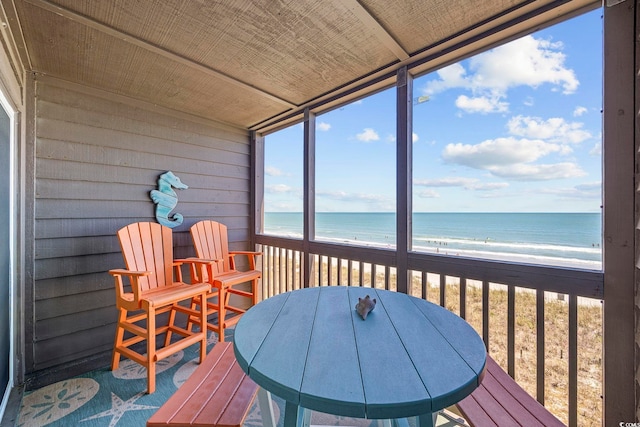 208 Ocean Blvd N Unit 324, North Myrtle Beach, SC 29582 - sunroom with view of water and beach and outdoor dining area