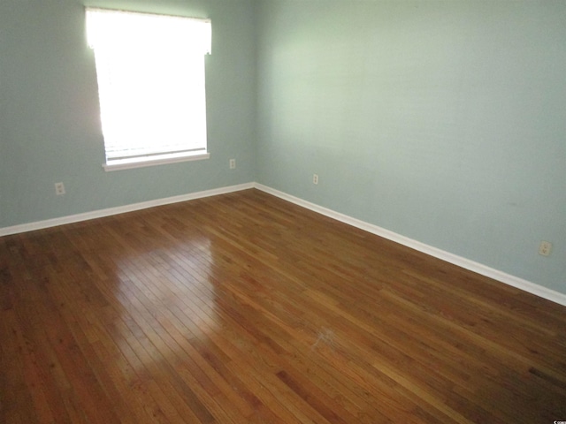 811 Rogers Rd, Myrtle Beach, SC 29577 - empty room with dark wood-style flooring and baseboards