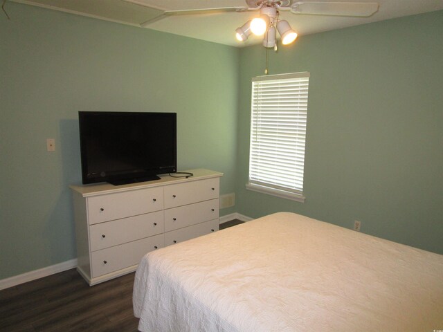 811 Rogers Rd, Myrtle Beach, SC 29577 - bedroom with dark wood finished floors, baseboards, and ceiling fan