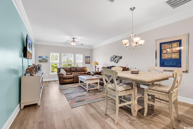232 Je Edward Dr Unit 19, Myrtle Beach, SC 29588 - dining space with ornamental molding, light wood-style flooring, baseboards, a chandelier, and a ceiling fan