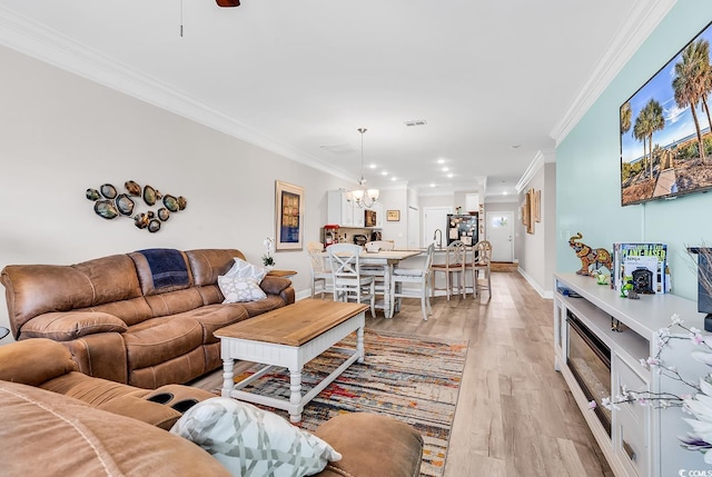 232 Je Edward Dr Unit 19, Myrtle Beach, SC 29588 - living area featuring a chandelier, crown molding, light wood-style floors, baseboards, and recessed lighting