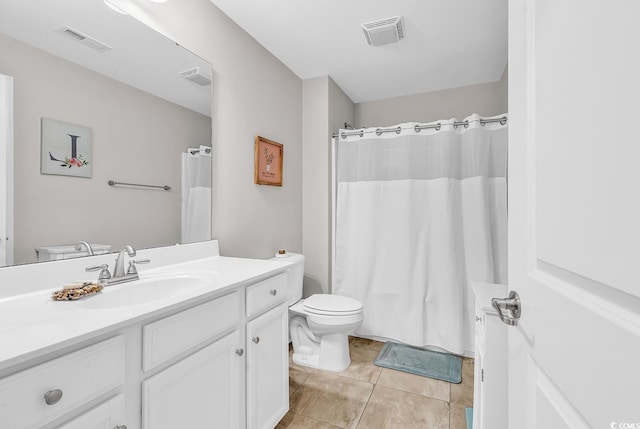 232 Je Edward Dr Unit 19, Myrtle Beach, SC 29588 - bathroom featuring vanity, toilet, tile patterned floors, and a shower with shower curtain