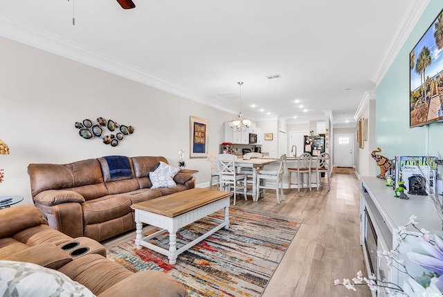 232 Je Edward Dr Unit 19, Myrtle Beach, SC 29588 - living room featuring ornamental molding, a chandelier, light wood finished floors, a ceiling fan, and recessed lighting