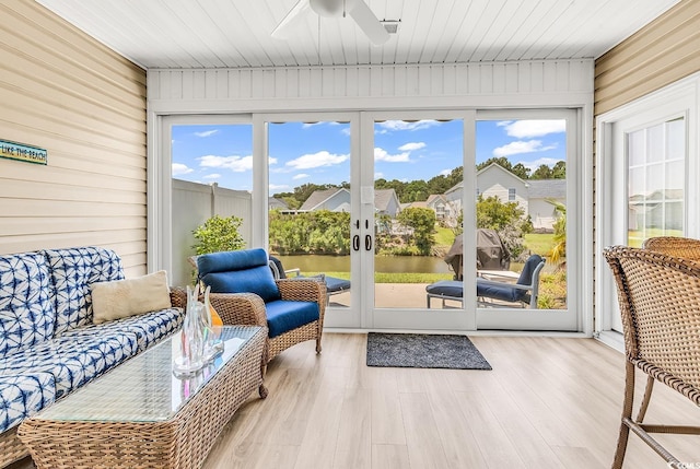 232 Je Edward Dr Unit 19, Myrtle Beach, SC 29588 - sunroom / solarium featuring wooden walls, a ceiling fan, wood finished floors, and a deck with water view
