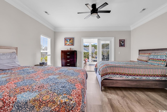 232 Je Edward Dr Unit 19, Myrtle Beach, SC 29588 - bedroom with multiple windows, wood finished floors, ornamental molding, a ceiling fan, and access to exterior