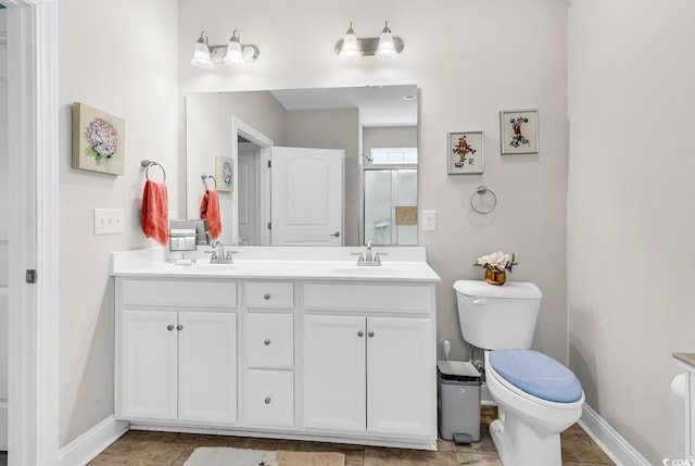 232 Je Edward Dr Unit 19, Myrtle Beach, SC 29588 - bathroom featuring toilet, double vanity, baseboards, and tile patterned flooring