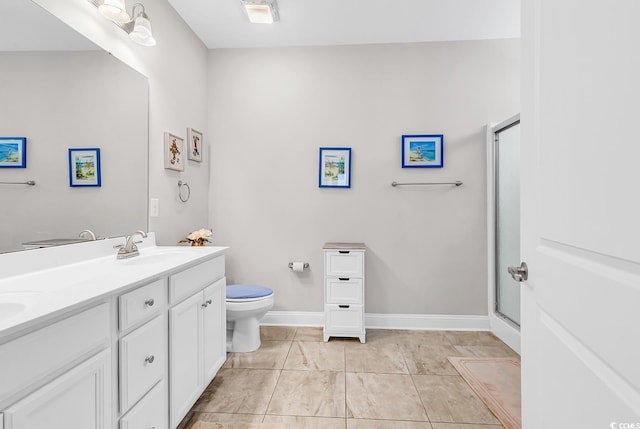 232 Je Edward Dr Unit 19, Myrtle Beach, SC 29588 - bathroom with toilet, double vanity, a shower with shower door, and baseboards