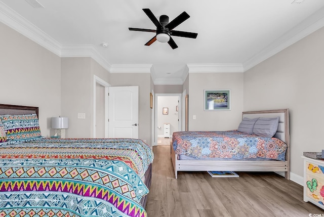 232 Je Edward Dr Unit 19, Myrtle Beach, SC 29588 - bedroom featuring wood finished floors, crown molding, baseboards, and a ceiling fan