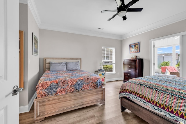 232 Je Edward Dr Unit 19, Myrtle Beach, SC 29588 - bedroom featuring crown molding, multiple windows, baseboards, wood finished floors, and a ceiling fan