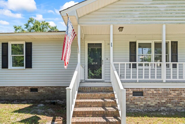 204 Elm St, Johnsonville, SC 29555 - entrance to property with crawl space and covered porch