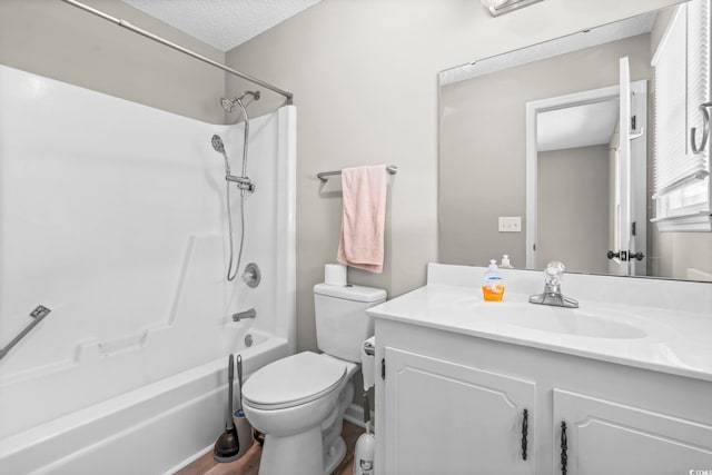 204 Elm St, Johnsonville, SC 29555 - full bathroom featuring vanity, bathing tub / shower combination, toilet, a textured ceiling, and wood finished floors