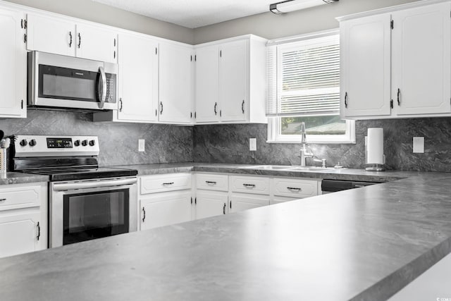 204 Elm St, Johnsonville, SC 29555 - kitchen with stainless steel appliances, a sink, and white cabinetry