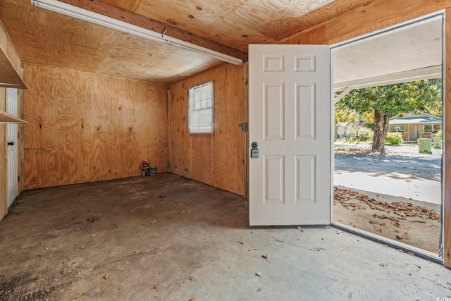 204 Elm St, Johnsonville, SC 29555 - foyer entrance with wooden walls and unfinished concrete floors