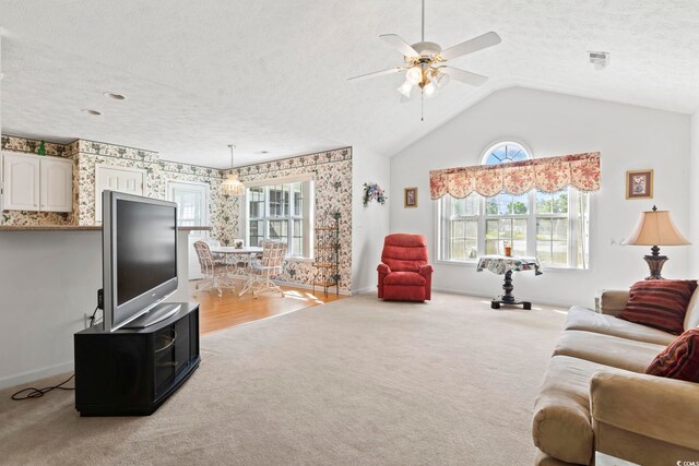 4012 Grousewood Dr, Myrtle Beach, SC 29588 - carpeted living area featuring a textured ceiling, ceiling fan, baseboards, and lofted ceiling