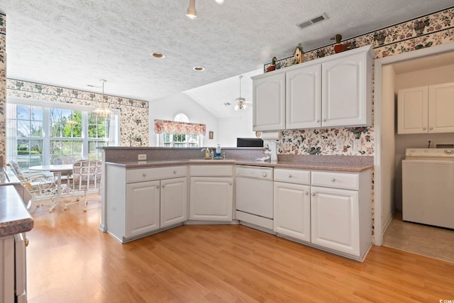 4012 Grousewood Dr, Myrtle Beach, SC 29588 - kitchen featuring washer / clothes dryer, dishwasher, light wood-style floors, a textured ceiling, and wallpapered walls