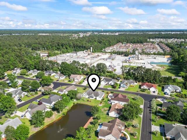 4012 Grousewood Dr, Myrtle Beach, SC 29588 - aerial overview of property's location with a heavily wooded area, a large body of water, and nearby suburban area