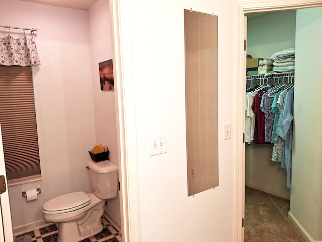 250 Nature Trl, Little River, SC 29566 - bathroom with toilet, baseboards, and a walk in closet