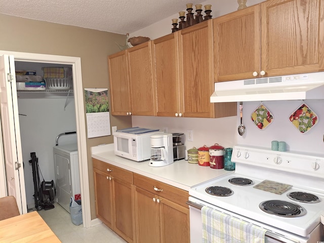 250 Nature Trl, Little River, SC 29566 - kitchen featuring under cabinet range hood, white appliances, light countertops, washer / dryer, and a textured ceiling