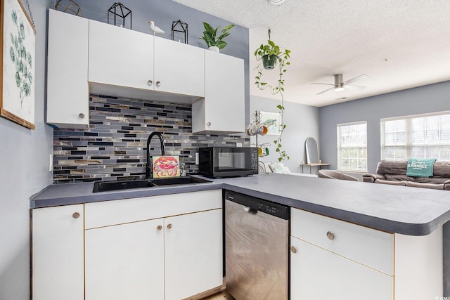 3939 Gladiola Ct Unit 202, Myrtle Beach, SC 29588 - kitchen with stainless steel dishwasher, a sink, black microwave, a peninsula, and tasteful backsplash