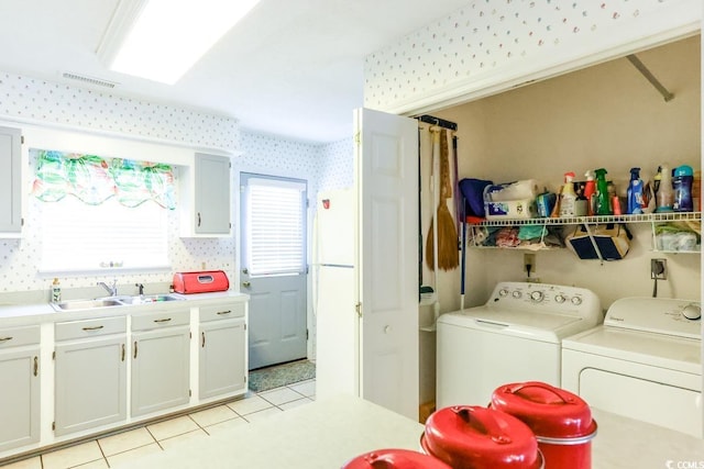 1437 Baldwin Ct Unit 1437, Little River, SC 29566 - laundry area featuring washer and dryer, wallpapered walls, and light tile patterned flooring