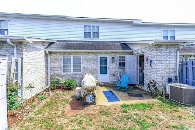 1437 Baldwin Ct Unit 1437, Little River, SC 29566 - back of house with a patio area and roof with shingles