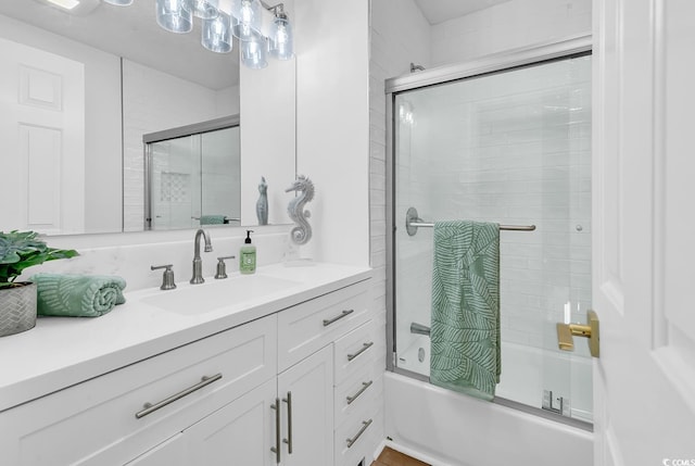 514 6th Ave S, Surfside Beach, SC 29575 - bathroom featuring vanity and bath / shower combo with glass door