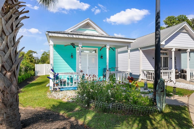 230 Addison Cottage Way, Murrells Inlet, SC 29576 - shotgun-style home with ceiling fan, covered porch, and metal roof