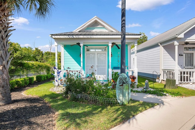 230 Addison Cottage Way, Murrells Inlet, SC 29576 - shotgun-style home featuring a ceiling fan, a front yard, and covered porch