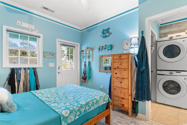 230 Addison Cottage Way, Murrells Inlet, SC 29576 - bedroom featuring stacked washing machine and dryer, crown molding, and ceiling fan